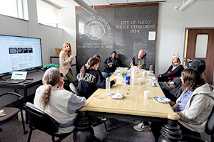 group eating and listening at Lunch and Learn